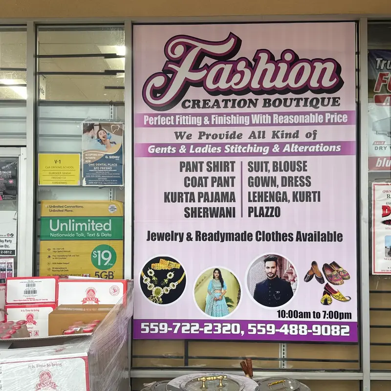 Fashion Creation Boutique window sign at 3620 W Shaw Ave
